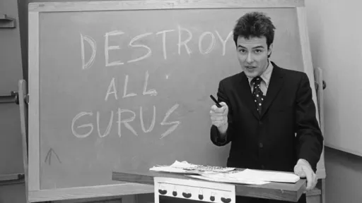Jello Biafra in front of a chalk board that reads "Destroy All Gurus"